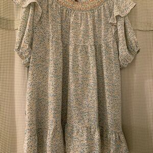 Green floral flutter puff-sleeve dress with pockets by Davi & Dani.